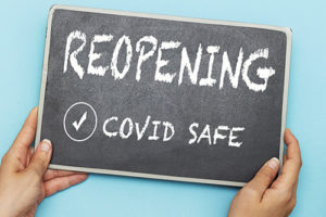 Reopening Covid Safe written on Chalkboard