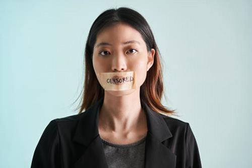 Woman with censored sticker over her lips