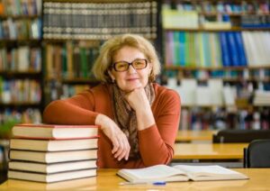 Woman leaning on books Female opera singer