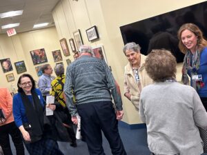 People gathering and talking in Oasis lobby