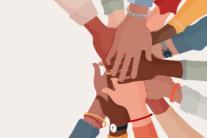 Diverse hands reaching in cooperation