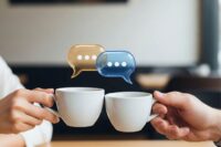 People clinking coffee cups with quote bubbles above them