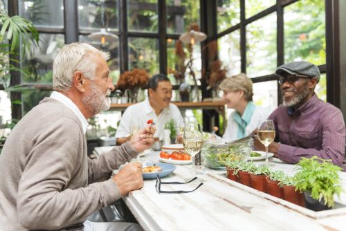 Lunch Bunch Older adults sitting around a table socializing